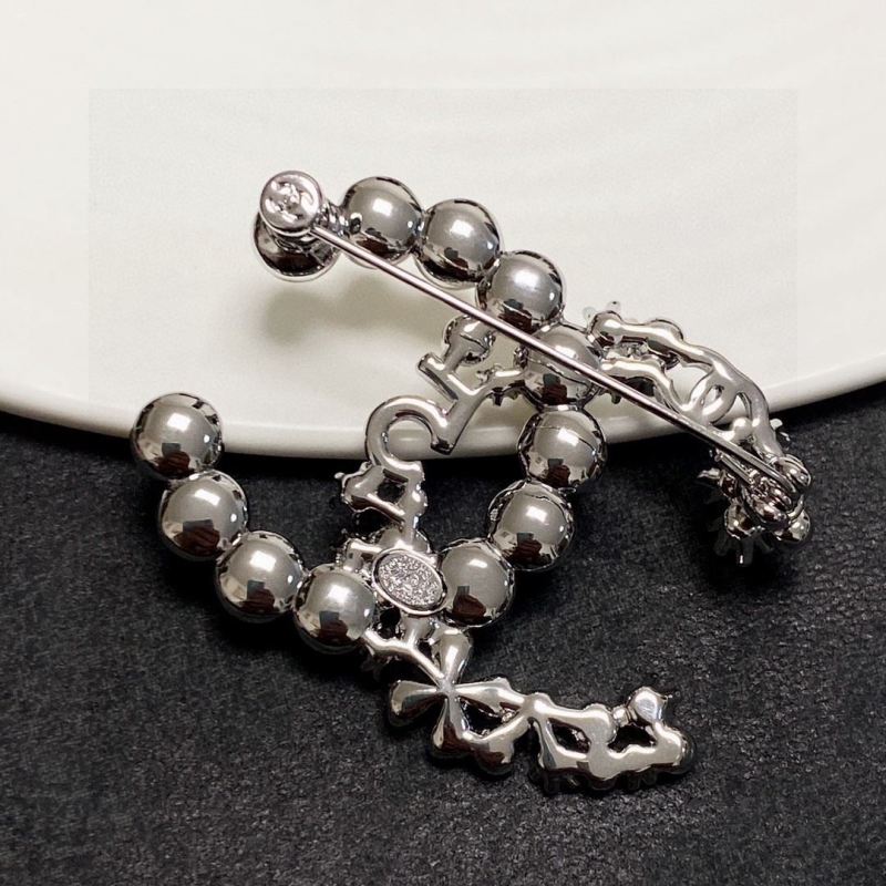 Ch**el brooches